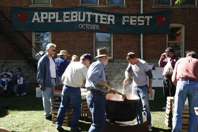 Group of people making apple butter at the apple butter festival in Grand Rapids, Ohio